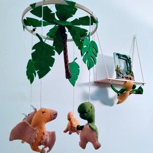 Dinosaur crib mobile with dinosaur shelf